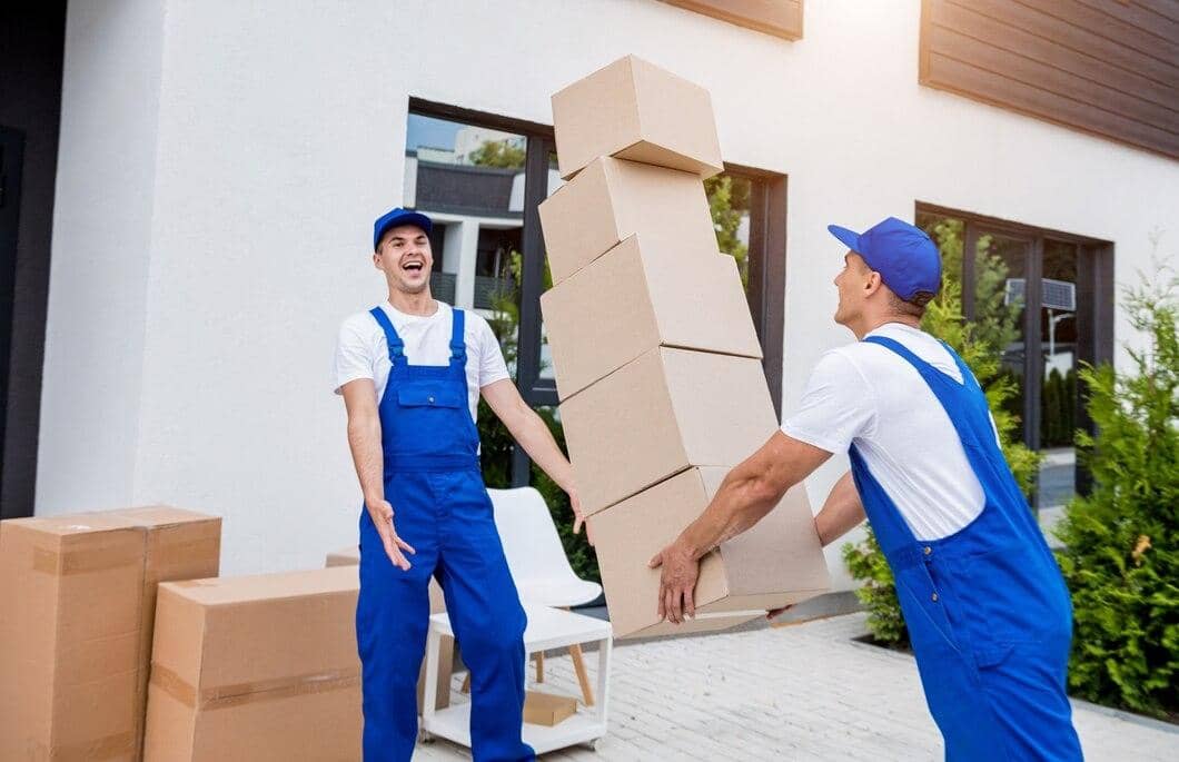 two-removal-company-workers-are-loading-boxes