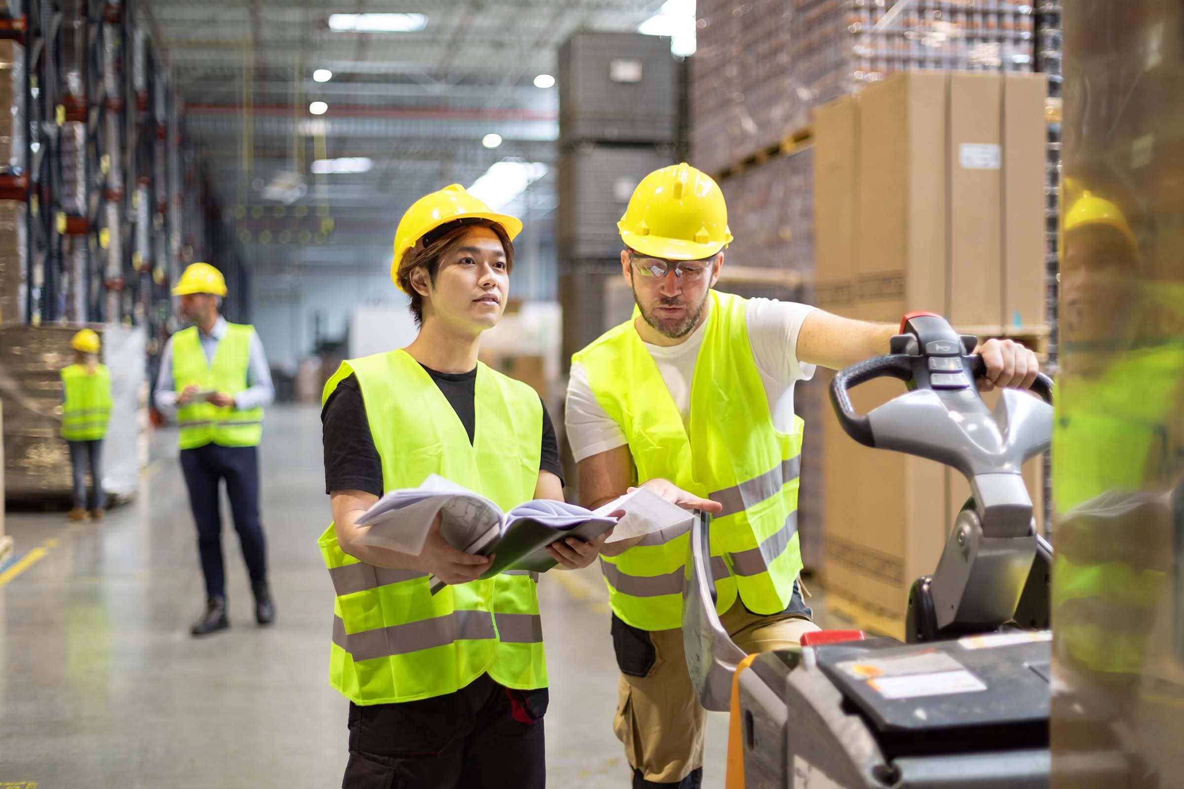 employees-consult-while-working-in-the-warehouse